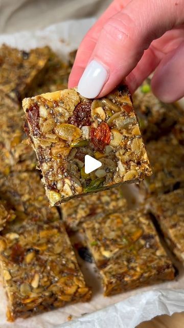 Sherri Davidson on Instagram: "THE MOST INCREDIBLE AND ADDICTING POWER BARS💥  Ingredients: In a mixing bowl add⬇️ - 1.5 cups rolled oats - 1/4 cup ground flax seeds - 3 tbsp chia seeds  - 1/4 cup pumpkin / sunflower seed blend - 1/4 cup Brazil nuts (chopped) - 1/4 cup walnuts (chopped) - 1/4 cup pistachios (chopped) - 1/4 cup goji berries - 1/4 cup chopped dates - 1/4 cup dried raisins or cherries - 1 tsp salt   - 1 cup good quality salted butter - 1/2 cup light brown sugar - 3 tbsp honey  - 1 tbsp vanilla extract   Step 1: In a bowl, add all of your nuts, seeds and dried fruits and a dash of salt.   Step 2: in a saucepan melt your butter then add in sugar and honey. Bring to a boil then back down to a high simmer and stir continuously for about 5 minutes until it thickens a bit. Then add Dates And Nuts Bar, Chia And Flax Seed Granola Bars, Chopped Dates, Dried Raisins, Seed Bars, Healthy Snack Bars, Nut Bars, Healthy Granola Bars, Pumpkin Sunflower