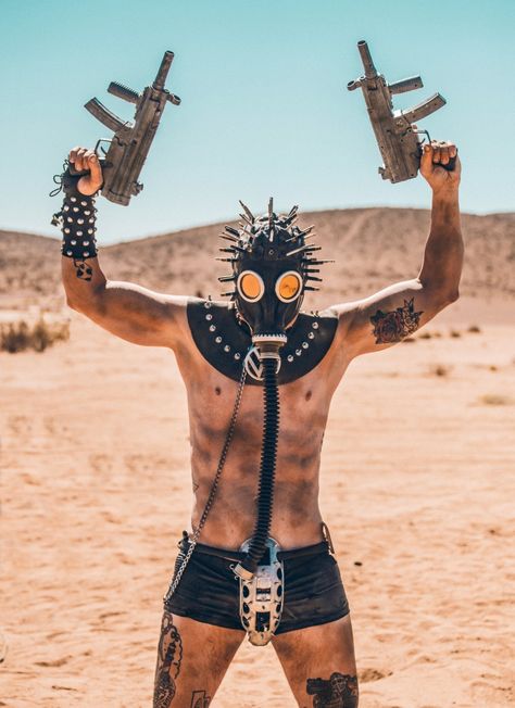 Wasteland Weekend: See Insane Photos From Epic 'Mad Max' Desert Party | Revolver Desert Party, Wasteland Weekend, Mushroom Cloud, Gas Mask, Mad Max, Weekend Outfit, Mask