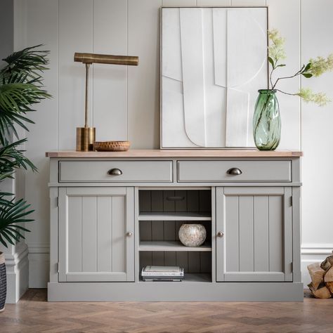 Ideal for the kitchens or dining areas, this sideboard offers practical storage with 2 drawers and 2 cupboards with adjustable shelves plus additional shelves in-between, the perfect spot for cookbooks. The hand painted subtly textured grooved doors, metal handles and grooved & planked oak top create a modern country feel perfectly suited to both rustic and contemporary interiors. Colour: Grey Country Farmhouse Style, Sideboard Grey, Wide Sideboard, Paint Storage, Solid Wood Sideboard, Large Sideboard, Kitchen Sideboard, Wooden Sideboard, Oak Sideboard