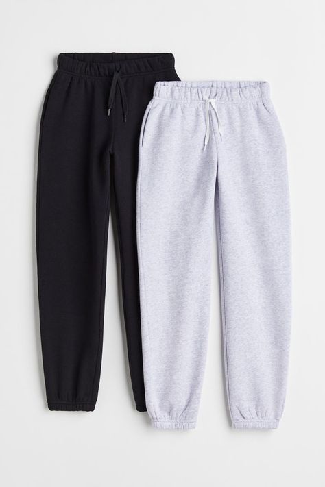 Track pants in sweat fabric. Featuring covered elastication and a drawstring at the waist and discreet side pockets. Tapered legs with covered elastication at the hems. Soft brushed inside. Girl Sweatpants, M Beauty, Black Accents, Drawstring Waistband, Black Light, Fashion Company, Tapered Legs, Track Pants, Capsule Wardrobe