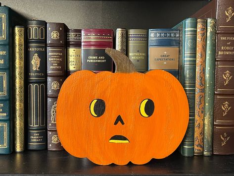 Express yourself or gift your one of a kind person this beautiful Over The Garden Wall inspired Pottsfield pumpkin which is hand painted with acrylic on a pumpkin shape Paulownia wood and it has glossy varnish/ finish. The pumpkin could be brighten up  on your shelf/ bookshelf or any desk.  Each pumpkin is unique and has its own little personality.  Find the one that you love best! Or collect them all for your Halloween party decorations.  You can add some festive fun to your Halloween decor with this lovely pumpkin.  A perfect gift for those who like to travel through the woods and into the unknown... Over The Garden Wall Jack O Lantern, Over The Garden Wall Decor, Otgw Party, Painted Pumpkin Sign, Pottsfield Pumpkin, Over The Garden Wall Pumpkin, Wall Jack, Pumpkin Tattoo, Halloween Outside