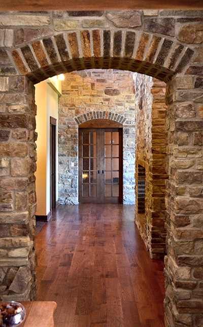 doorway Natural Stone Interior Design, Homes With Arched Doorways, Brick Arch Doorway, Stone Archway Interior, Wide Arched Doorway, Interior Stone Archway, Brick Entryway, Stone Doorway, Medieval Interior