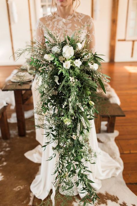 Gorgeous Cascading Wedding Bouquets ❤ See more: http://www.weddingforward.com/cascading-wedding-bouquets/ #weddings Black Cascade Wedding Bouquet, Cascade Eucalyptus Bouquet, Sage Green And Navy Blue Bridal Bouquet, Flowy Bouquet, Bouquets Ideas, Greenery Wedding Bouquet, Highlands Wedding, Wedding Plants, Cascading Bridal Bouquets