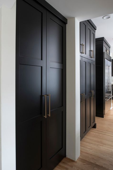 Tall black pantry cabinet doors Pantry Door Between Cabinets, Kitchen Pantry Cupboard Design, Tall Pantry Doors, Modern Kitchen With Pantry, Black Pantry Doors, White Glam Kitchen, Custom Pantry Ideas, Floor To Ceiling Pantry Cabinets, Floor To Ceiling Cupboards