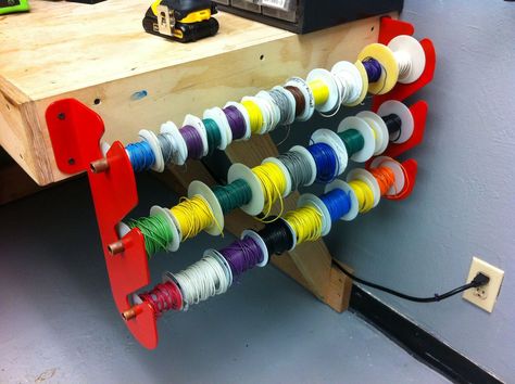 How to make a wire rack - could be used for ribbons as well Electronics Workspace, Spool Storage, Barn Organization, Tool Display, String Shelving, Electronic Workbench, Wire Spool, Trailer Storage, Factory Architecture