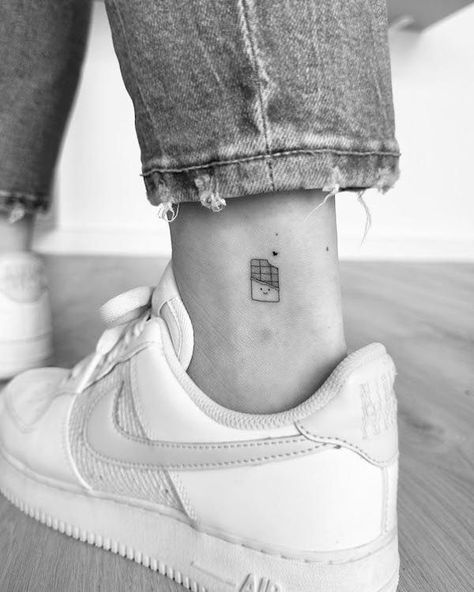 Below Ankle Tattoo, Fine Line Daughter Tattoo, Tattoo Ideas On The Leg, Chocolate Bar Tattoo, Tattoo Ankle Woman, Chocolate Tattoos, Single Needle Tattoo Ideas Women, Outside Ankle Tattoo, M&m Tattoo