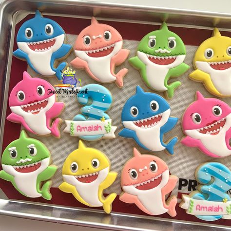 *Before ordering please check shop announcements for blocked out dates*  If an order is placed for a date that is no longer available the order will be canceled and fully refunded. This listing is for 2 dozen baby shark theme cookies.  -4 personalized numbers  -4 baby sharks  -4 daddy shark  -4 mommy shark  -4 grandpa shark  -4 grandma shark  When ordering please include the date need by, as well as any personalizations  (Name; age: etc) PACKAGING CHOICES -HEAT SEALED....Best if you're planning on placing them on a platter for an event and don't want them wrapped. This will allow you to keep them fresh and then right before the event, open them up and place them on the table. These can also be left in the bag. -Favors with ribbon ...perfect for party favors Cookies will be sealed in bags f Shark Party Favors, Grandpa Shark, Birthday Sugar Cookies, Shark Birthday Cakes, Shark Themed Party, Mommy Shark, Shark Cookies, Shark Themed Birthday Party, Theme Cookies