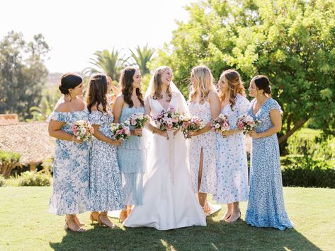 Bride in Carolina Herrera silk v neck gown with pink and ivory bridal bouquet with ivory ribbon and bridesmaids in mix match blue print pattern dresses for a wedding at Rancho Valencia. Cavin Elizabeth Photography Bridesmaid Dresses Blue And Pink, Mismatched Bridesmaids And Groomsmen, Light Blue Mismatched Bridesmaids, Blue Patterned Bridesmaid Dresses, Mismatched Bridesmaids Blue, Pink And Blue Bridesmaid Dresses, Bridesmaids Palette, Mixed Blue Bridesmaid Dresses, Blue Mismatched Bridesmaids