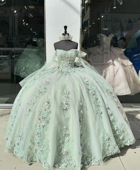 Light Green Xv Dresses, Sage Green With Gold Quinceanera Dresses, Sage Green Quinceanera Dresses Butterfly, Quncie Dresses Sage Green, Sage Green And Purple Quince Dress, Light Green 15 Dresses Quinceanera, Light Sage Green Quince Dress, Quinceanera Dresses Light Green, Pastel Green Quinceanera Dresses