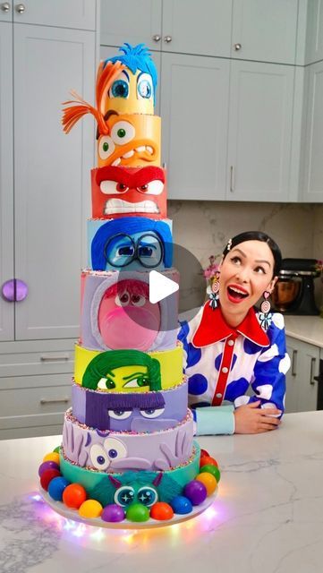 Katherine Sabbath on Instagram: "This is my most epic cake project yet! I’m embracing & celebrating all the emotions ahead of the release of @disneyaunz & Pixar’s #InsideOut2! This gigantic cake is made with layers of raspberry swirl sponge, filled with thick caramel & malted milk Swiss meringue buttercream. I used a mix of meringue buttercream & fondant to create each Emotion. The ‘memory orbs’ along the bottom of the cake are created with white chocolate spheres 🟣✨  My creative concept was to feature all nine Emotions in one epic, grand-scale, colourful cake with one tier for each Emotion. From top to bottom you can see: Joy, Anxiety, Anger, Sadness, Embarrassment, Disgust, Ennui, Fear & Envy. I’m super pleased this cake was shared around the studio with special guest Amy Poehler on @th Inside Out 2 Cake Ideas, Inside Out 2 Birthday Cake, Colourful Cakes Birthday, Inside Out 2 Cake, Inside Out Birthday Cake, Inside Out Cake Ideas, Slime Birthday Cake, Inside Out Birthday Party, Inside Out Cake