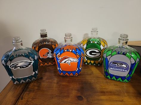 Painted Crown Royal Bottles, Crown Bottle Crafts, Crown Royal Diy, Crown Bottles, Crown Royal Crafts, Alcohol Bottle Decorations, Alcohol Bottle Crafts, Crown Royal Bottle, Sports Crafts