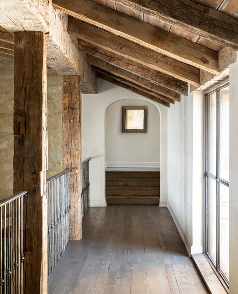 Catwalk In House Interior Design, Beams On Ceiling Living Room, Hallway With Beams, Weekend House Interior, Texas Ranch Aesthetic, Timberframe Interiors, Limestone Interior, Modern Rustic Lake House, Modern House In The Woods