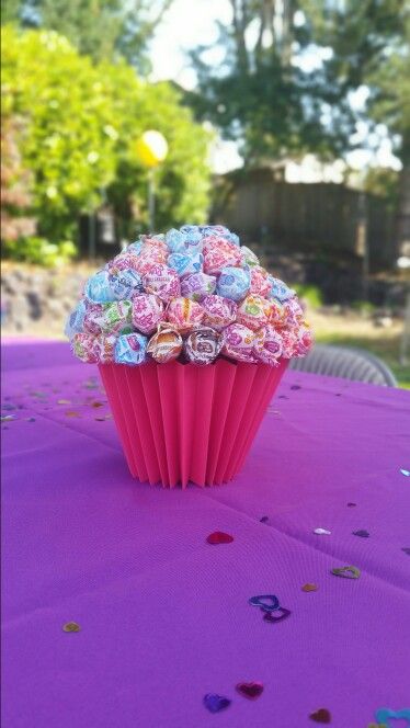 Dum dum cupcake centerpiece. Cupcake Centerpieces Birthday, Cupcake Theme Birthday Party Decorations, Cupcake First Birthday Theme, Cupcake Commons Candyland Decorations, Two Sweet Party Centerpieces, Cupcake Theme Birthday Party Decorations Ideas, Cupcake Centerpiece Ideas, Cupcake Birthday Theme, Cupcake Decorating Birthday Party