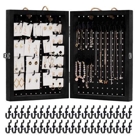 PRICES MAY VARY. DOUBLE DISPLAY - Despite its compact size 16” (H) x 12” (W) x 3.3” (D) when closed, both pegboards open up to a whopping 16” (H) x 24” (W) display. The usable display area measures 14.5” x 10.5” (excluding frame) on each pegboard. This design is ideal for efficient storage in tight spaces, making it a practical choice for retailers with limited storage capacity. EASY REARRANGEMENT - Retailers can quickly adjust the layout by moving pegs or hooks to accommodate changing inventory Pegboard Earring Display, Display For Craft Show, Peg Board Display, Jewelry Vendor Display, Black Pegboard, Pegboard Display, Vendor Displays, Jewelry Vendor, Display Area