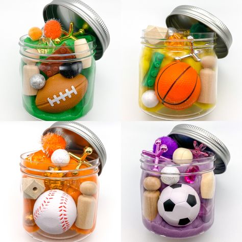 Basketball soccer football baseball playdough jar sensory party activity Play Dough Jars, Basketball Birthday Party Favors, Kids Sports Birthday Party, How To Make Playdoh, Sensory Party, Boy Birthday Favors, Sensory Jars, Activity Jar, Play Doh Activities