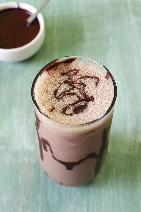 The classic Homemade Chocolate Milkshake Recipe with ice cream. This is thick chocolate shake made with chocolate syrup, milk and ice cream. This is the BEST milkshake and easy to make. Yes it gets ready in 5 minutes only. You can make it healthy by making it without ice cream. Though, it won’t be thick anymore. It will taste more like chocolate milk. #chocolatemilkshake #milkshakerecipe #chocolate #summerbeverage Chocolate Milkshake Recipe No Ice Cream, Milkshake Recipe With Ice Cream, Homemade Chocolate Milkshake, Easy Chocolate Milkshake Recipe, Kids Milkshake, The Best Milkshake, Chocolate Milkshake Recipe, Vanilla Milkshake Recipe, Chocolate Shake Recipe