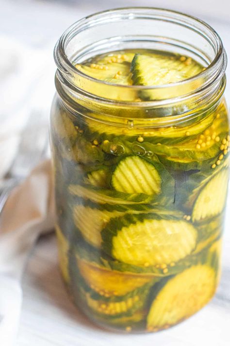 Garden fresh cucumbers and just a few simple ingredients and you can make your own easy Bread and Butter Pickles from scratch! Canned Bread And Butter Pickles Recipe, Bread And Butter Pickle Recipe, Bread N Butter Pickle Recipe, Bread And Butter Pickles, Vinegar Cucumbers, Butter Pickles, Peach Sorbet, Pickle Recipe, Refrigerator Pickles