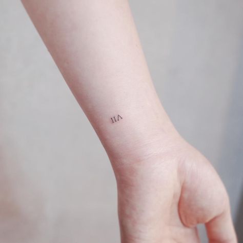 VII tattoo by @wittybutton_tattoo - Tattoogrid.net Vii Tattoo, Roman Numeral Wrist Tattoo, Meaningful Word Tattoos, Roman Tattoo, Roman Numeral Tattoo, Numeral Tattoo, 7 Tattoo, Roman Numeral Tattoos, Tattoo Wrist