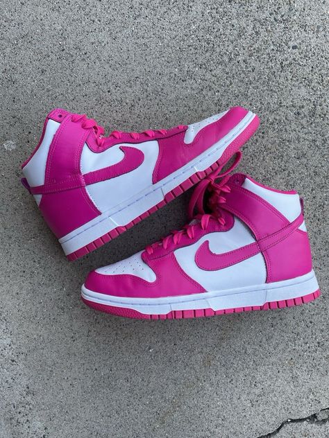 Elevate your sneaker game with these Nike Dunk High WMNS sneakers in a stunning pink colorway. Featuring a high-top shoe shaft style and lace-up closure, these sneakers are designed to provide both style and comfort. The upper material is made of premium leather, ensuring durability and longevity. With a style code of DD1869-110, these sneakers are a must-have for any Nike enthusiast. The Nike Wmns model is a women's specific design, with a US shoe size of 7.5. These athletic sneakers were released in 2022 and are part of the Nike Dunk product line. Don't miss out on the opportunity to add these stylish sneakers to your collection. Dunk High Pink Prime, Nike High Dunks, Nike High, Sneakers Looks, Nike Dunk High, Dunk High, High Shoes, Nike Sneakers Women, Pink Nikes