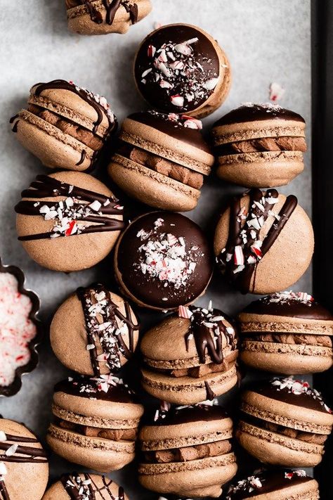 These triple chocolate peppermint macarons are as adorable as they are delicious. Dunked or drizzled in melted chocolate and sprinkled with crushed candy canes, these festive cookies are the perfect holiday treat! Peppermint Macarons, Desserts With Chocolate Chips, Best Holiday Cookies, Chocolate Macaron, Festive Cookies, Macaroon Recipes, Browned Butter, Macaron Recipe, Melted Chocolate