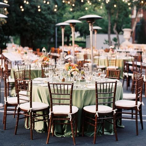 Sage-green linens topped some of the tables, and café lights were strung overhead. Table Settings Sage Green, Fall Wedding Linens, Wedding Linens Ideas, Wedding Design Board, Velvet Decor, Wedding Mint Green, Green Tablecloth, Wedding Table Linens, Wedding Tablecloths