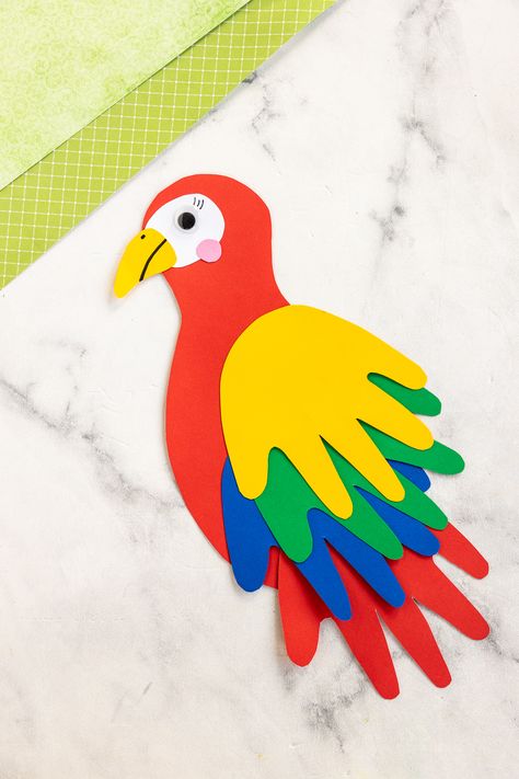 finished paper parrot handprint craft Birds Activity For Preschool, Bird Arts And Crafts, Handprint Parrot, Templates Animals, Paper Parrot, Ara Parrot, Bird Crafts Preschool, Jungle Animal Crafts, Vbs Jungle