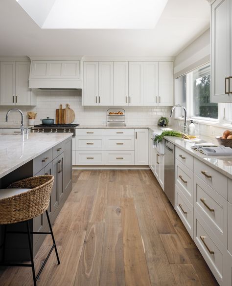 We created a fresh, modern space with white cabinetry that brightens the entire room, while the grey island adds a sophisticated contrast. The rich wood flooring brings in warmth and character, perfectly complementing the sleek finishes. And the hidden pantry? It’s a clever design feature that maximizes storage without sacrificing style!⁠ ⁠ This kitchen is all about balance – clean lines, functional spaces, and thoughtful details. It’s a perfect blend of beauty and practicality for a lakeside... Kitchen Wood Floor, Grey Island, Gray Island, Hidden Pantry, Light Wood Floors, White Cabinetry, Wood Flooring, Clever Design, The Grey