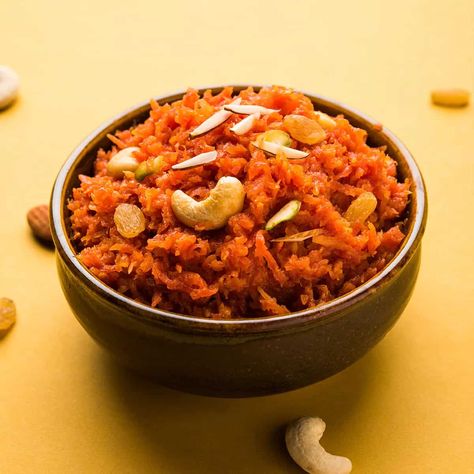 A traditional sweet ( halwa) of grated carrots cooked in ghee, milk and sugar and flavoured with cardamom and cashew nuts. Gajar Halwa is a quintessential Indian dessert made with carrots, ghee, milk, sugar and flavored with cardamom. It's rich, creamy and do decadent. Do use ghee, nuts and cardamom though for added flavor though but if you want to make the halwa without ghee a lot of times go ahead because it still tasted great. Carrots Cooked, Gajar Halwa, Carrot Halwa, Bar Packaging, Halwa Recipe, Milk And Sugar, Indian Dessert, Indian Cooking Recipes, Cold Desserts