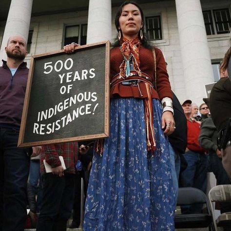 "500 Years of Indigenous Resistance!" Activist Denae Shanidiin stands near Bears Ears National Monument, southeastern Utah, c. 2018.  Photo credit: Denae Shanidiin — at Bears Ears National Monument. Protest Fashion, Julian Assange, Red House, Vogue Magazine, American Pride, Runway Models, Quinceanera Dresses, Girl Clothes, Fashion Magazine