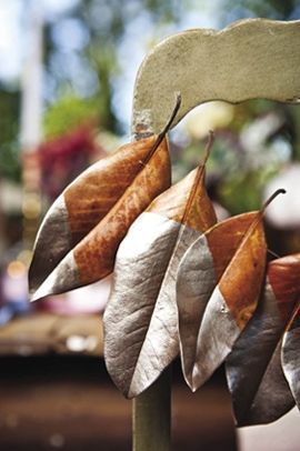 Decorating with Magnolia Leaves During the Holidays Decorating With Magnolia Leaves, Antique Gold Paint, Painted Magnolia, Magnolia Leaf Garland, Holiday Floral Arrangements, Magnolia Leaf, Leaf Projects, Magnolia Wedding, Gold Chair