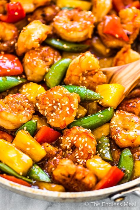 PIN TO SAVE FOR LATER! Pineapple shrimp stir fry is a sweet, delicious, and healthy dinner recipe that's always a hit. An easy to make stir fry sauce coats the tender shrimp, sweet pineapple chunks, and our favorite veggies. It's quick to make and so much better than takeout! #theendlessmeal #shrimpstirfry #pineapple #shrimp #prawns #pineapplestirfry #stirfry #pineappleshrimpstirfry #refinedsugarfree #takeout #takeoutrecipes #chinesetakeout #stirfryrecipes #healthyrecipes #shrimprecipes Stir Fry Shrimp Recipes, Pineapple Shrimp, Pineapple Chunks, Shrimp Stir Fry, Pork Stir Fry, Healthy Dinner Recipe, Better Than Takeout, Takeout Food, Shrimp Recipes For Dinner