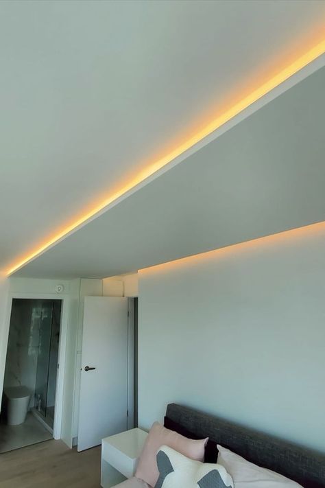 We incorporated these hidden ceiling linear light to this bedroom to provide a more luxurious look! Hidden Ceiling Lighting, Ceiling Hidden Light, Coved Ceiling, Drop Ceiling Lighting, Dental Office Design Interiors, Hidden Lighting, Angled Ceilings, Linear Light, Palace Interior