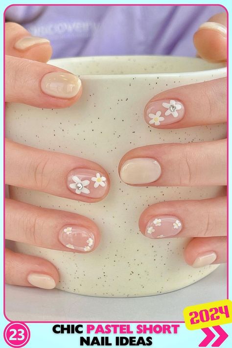 Short nails with floral accents on a neutral base, adding femininity and charm. Perfect for everyday wear, these pastel pink nails create a sweet and delicate look. Korean Flower Nails, Simple Flower Nail Designs, Valentines Nails Ideas, Cny 2024, Nail Spring, Cat Eye Nails Polish, Art Deco Nails, Hippie Nails, Cute Simple Nails