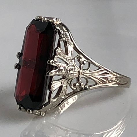 Details: Stunning Edwardian Period garnet and 14K white gold filigree ring! The stone measures 14.5mm by 7mm, and the is 4.6mm above the finger at the highest point on the ring. The filigree is beautiful on this ring, and is in lovely shape. This is a stunning ring--you will not be disappointed! Please ask all necessary questions prior to placing an order. Measurements: The size is 4 1/2 US and can be sized for a fee. Condition: The overall all condition of this ring is very good. Medieval Rings Engagement, Filigree Ring Gold, Wax Ring, Edwardian Ring, Edwardian Jewelry, Easy Diy Jewelry, Victorian Rings, Amethyst Bracelet, Gold Filigree