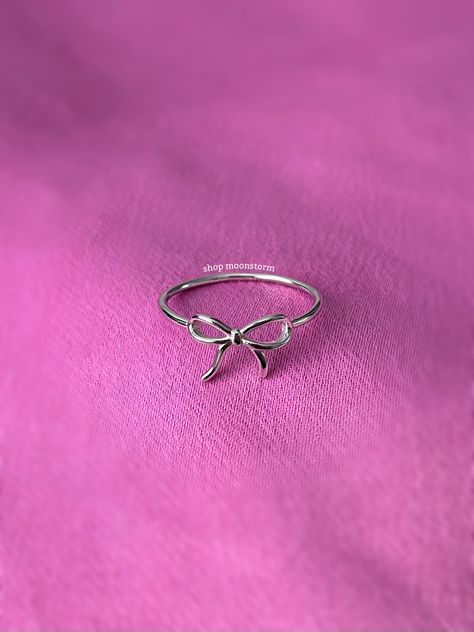 A stunning coquette style ring featuring a sweet ribbon bow tie. - Water resistant - 925 sterling silver - Will not rust or tarnish - Select desired size at checkout Rings For Birthday Gift, Dainty Rings Minimalist Jewelry Silver, Girly Jewelry Silver, Silver Bow Ring, Silver Bow Jewelry, Rings Coquette, Coquette Rings, Cute Rings Silver, Coquette Ring