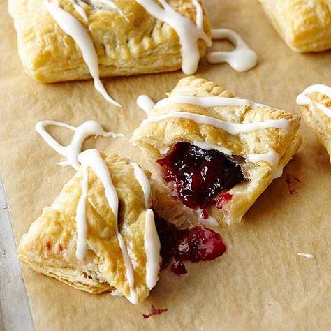 Cherry Pomegranate Danish: Tart filling bakes inside flaky puff pastry. For pink icing, use pomegranate juice instead of milk and butter. Pomegranate Pastries, Brunch Bread, Tart Filling, Pink Icing, Egg Recipes For Breakfast, Frozen Puff Pastry, Cherry Recipes, Puff Pastry Sheets, Pastry Sheets