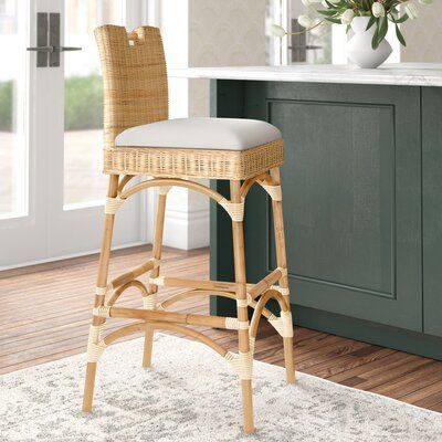 For elevated dining at a home bar or kitchen island, this stool adds a charming nautical touch to any home. The intricate, interwoven design of the seat and back sits on a gently curved, arched frame that adds to the natural aesthetics of this piece. Crafted from wicker rattan, this stool has a high back and a cushioned seat filled with foam and upholstered in a blend of polyester and cotton. With its array of finish options, this stool is a versatile addition to any living room, dining room, or Beach Bar Stools, Counter High Bar Stools, Gold Bar Stools Kitchen Island, Coastal Bar Stools, Bar Stool Wood, Wicker Bar Stools, Split Foyer, Island Chairs, Natural Aesthetics