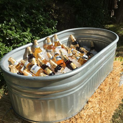 Our galvanized water trough makes for the perfect drink cooler Backyard Wedding Cooler Ideas, Galvanized Tub For Drinks At Wedding, Galvanized Tub Drink Station, Stock Tank Drink Cooler, Stock Tank Cooler Wedding, Beer Tubs For Wedding, Water Trough Cooler Wedding, Water Trough Drink Cooler, Water Trough Wedding Drinks