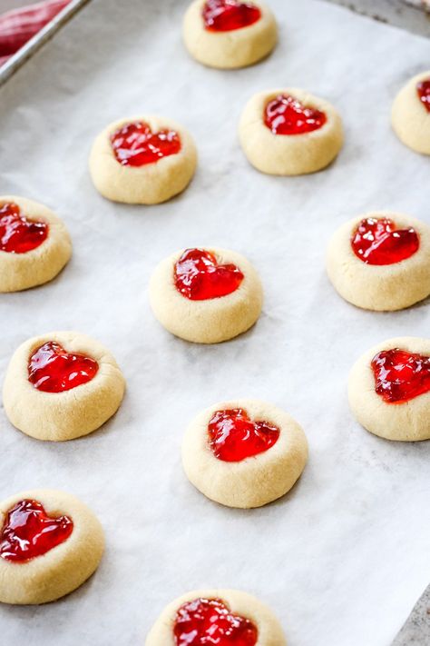 These Valentine's Day Thumbprint Cookies are so cute and delicious! With a brown sugar shortbread base and red jelly hearts, these are perfect for love day! You might want to double the batch! ❤️ Sugar Shortbread Cookies, Brie Cheese Appetizer, Brown Sugar Shortbread, Raspberry Thumbprint Cookies, Small Batch Cookies, Jelly Hearts, Valentine Sugar Cookies, Thumbprint Cookies Recipe, Buttery Shortbread Cookies