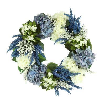 Experience the beauty of this gorgeous 26" wreath. Adorned with an array of enchanting blue and white hydrangeas, blue heather and added lilac, it will bring refreshing colors to any room in your home. The best part? You don't have to wait for spring; you can have the vibrant colors of this stunning wreath right at your doorstep! Hang it up today and admire its simple beauty - it is sure to be the perfect addition to your living space. Creative Displays, Inc. 26" Assorted Hydrangea, Heather and Lilac Wreath, Hydrangeas Blue, White Hydrangeas, Mothers Day Wreath, Door Wreaths Diy, Creative Display, Wreaths Diy, Pet Gate, Pillows Flowers