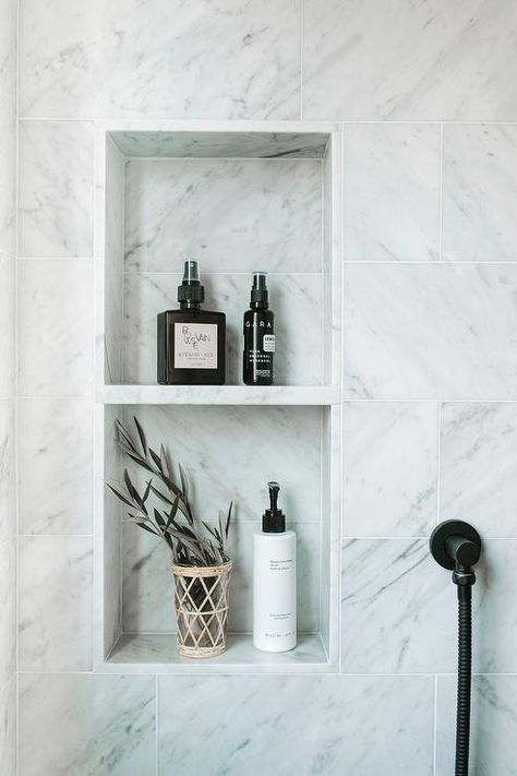 A marble shower niche fitted with tow shelves is framed by staggered honed marble wall tiles. Subway Tile Shower Niche, Marble Niche, تصميم دورة مياه, White Subway Tile Shower, Tile Shower Niche, Marble Shower Tile, Bathroom Niche, Marble Shelf, Diy Dresser Makeover