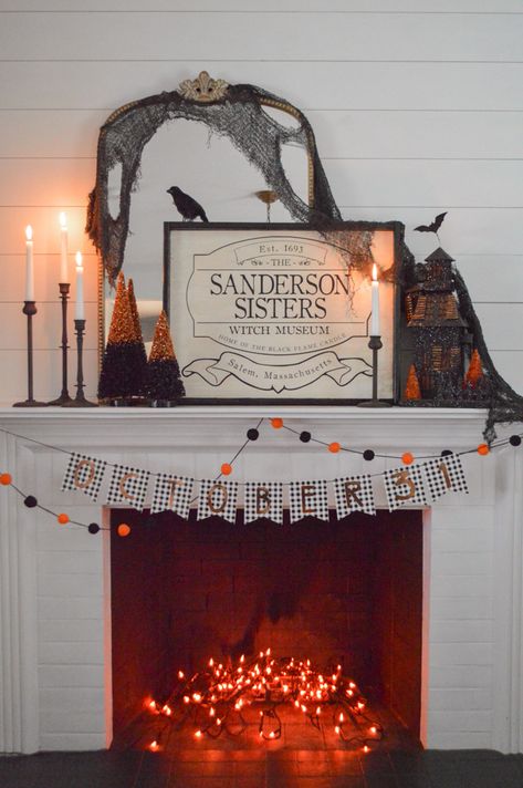 I created a fast and easy, classic black and orange Halloween mantel in less than 15 minutes by using everyday and inexpensive seasonal decor items! The only new addition was a Hocus Pocus inspired sign I bought, which also supported a small business! #halloweendecoratingideas Hocus Pocus Halloween Decor Indoor, Hocus Pocus Decor, Hocus Pocus House, Hocus Pocus Halloween Decor, Hocus Pocus Decorations, Halloween Mantle Decor, Halloween Fireplace, Hocus Pocus Party, Halloween Mantle