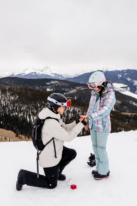 Couple in snowboarding attire. A proposal down on one knee as he puts the ring on her finger on top of the ski mountain. Snowboarding Proposal, Ski Proposal, Colorado Proposal, Colorado Snowboarding, Vail Ski Resort, Ski Wedding, Breckenridge Ski Resort, Vail Skiing, Vail Village