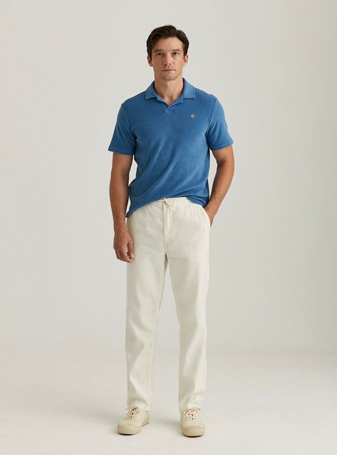 Embrace a clean, casual style with a sharp blue polo shirt paired with beige chinos and matching sneakers. A perfect ensemble for a stylish yet comfortable day out, blending vibrant and neutral tones with ease. Cream Sneakers, Beige Pants Outfit, Matching Sneakers, Blue Polo Shirt, Beige Chinos, Beige Sneakers, Cream Pants, Pants Outfit Men, Blue Polo Shirts