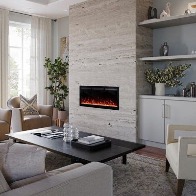 The Vibrance Smart Linear Electric Fireplace makes designer style, premium features and convenient operation accessible to everyone. Flexible installation options allow this wall mounted electric fireplace to be installed fully recessed within a wall or simply surface mounted. Smart capabilities provide app control and voice commands using Amazon Echo/Alexa or Google Home with a Wi-Fi connection, giving you the ultimate level of convenience. Modern Ember Size: 18" H x 42" W x 5" D | Modern Ember Tiled Fireplace Wall, Modern Fireplace Ideas Living Rooms, Mid Century Modern Fireplace, Black Electric Fireplace, Linear Electric Fireplace, Electric Fireplace Living Room, Wall Mounted Electric Fireplace, Mounted Electric Fireplace, Electric Fireplace Wall