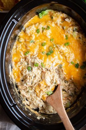 Slow Cooker Green Chile Chicken and Rice Casserole #crockpot #slowcooker #casserole #chicken #chickenrecipes #crockpotrecipes #cheesy #spicy Green Chili Chicken Casserole Crockpot, Green Chili Chicken Crockpot Slow Cooker, Slow Cooker Green Chili Chicken And Rice, Green Chili Crockpot Recipes, Chicken Green Chili Crockpot, Crockpot Green Chili Chicken, Green Chili Chicken Crockpot, Green Chile Chicken And Rice, Slow Cooker Casserole Recipes