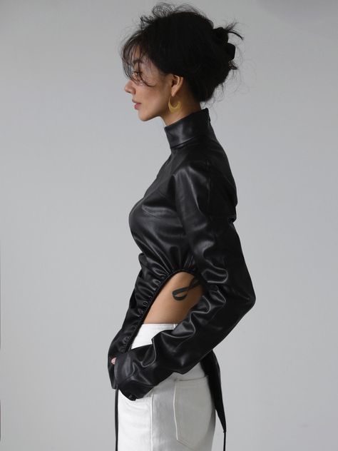 Chic vegan leather top with side shirring for a cinched waist look. Perfectly mimics lambskin with high quality PU. Fabric contains natural stretch. Model is in MINUSEY S. * MINUSEY S = EU 34, US 2* MINUSEY M = EU 36, US 4* 100% PU Leather* Dry clean* Made in Korea - Model Height: 169cm/5'6" (US2, EU34) Normcore Fashion, Cyberpunk Fashion, Black Leather Gloves, Pu Fabric, Utila, High Neck Top, One Piece Outfit, Fantasy Clothing, Teenage Fashion Outfits