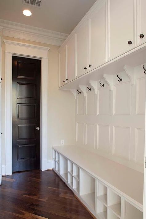 Mudroom with Paneled Walls and Shoe Cubbies Victorian Mudroom, Long Mudroom, Backpack Rack, Wood Paneled Walls, Entry Way Lockers, Beadboard Trim, Shoe Cubbies, Transitional Laundry Room, Wall Cubbies