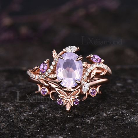 Item description ✦ Handmade, high-quality item! ✦ Material: 925 sterling silver, Solid 10k/14K/18K GOLD (can be made in white/rose/yellow gold) Engagement ring ✦ Center stone: Natural Lavender Amethyst. ✦ Size/Weight: 6x8mm Oval Cut ✦ Side stones: Marquise Cut Natural Amethyst and Marquise Cut/Round Cut Moissanites Wedding band ✦ Gemstones: Round Cut Natural Amethyst Any ring size can be made,if the ring size is not in the option list ,contact me. As it is handmade,it needs 2-4 weeks to finish and then be shipped by usps or DHL. Return policy: We offer 30 days return policy. For any reason, if you are not completely satisfied with your order, you may return it for a refund.  Buyer is responsible for the handcraft fee (15%-30% of the total price) and the return shipping cost. Rings With Purple Stones, Purple Gemstone Engagement Rings, Amythest Wedding Ring Unique, Opal And Amethyst Ring Engagement, Amethyst Wedding Ring Set, Lavender Engagement Ring, Purple Wedding Ring, Amethyst Engagement Rings, Purple Engagement Ring