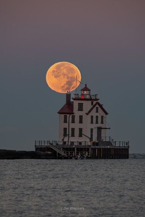 LORAIN, OHIO BY PHOTOS | This morning, the perfect conditions were present to catch the Hunter’s Moon setting behind the Lorain Harbor Lighthouse as the sun rose in the east... | Facebook Lorain Ohio, Moon Setting, Hunter S, The Hunter, The East, Nature Beauty, This Morning, Lighthouse, Ohio